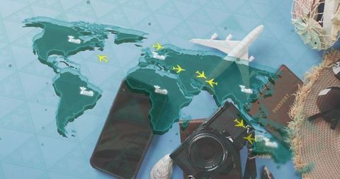 Planning world travel with passport, camera, smartphone and model airplane flatlay