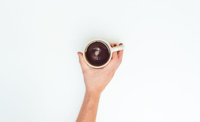 Hand Holding Coffee Mug Against White Background - Download Free Stock Photos Pikwizard.com