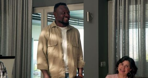 Diverse Group Therapy Session Involving Smiling Participants