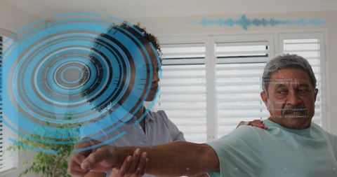 Therapist Guiding Senior Through Arm Rehabilitation With Holographic Digital Interface