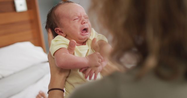 Mother Comforting Crying Newborn Baby at Home - Download Free Stock Images Pikwizard.com