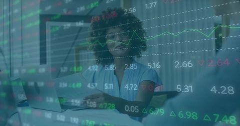 Financial analyst presenting market data in modern office environment