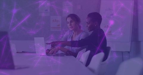 Collaborating Women Analyzing Charts with Digital Network Overlay