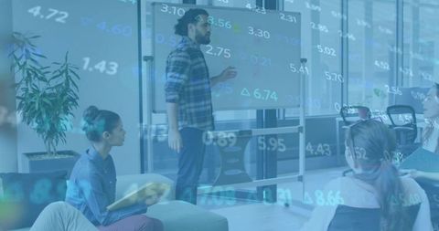 Collaborative team analyzing data in modern office lounge