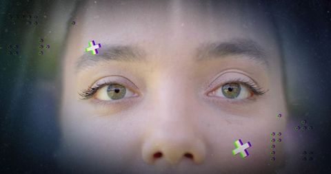 Closeup portrait showing green eyes with digital glitch overlay, cinematic gaze and film grain