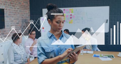 Businesswoman Using Tablet with Data Analytics in Modern Office