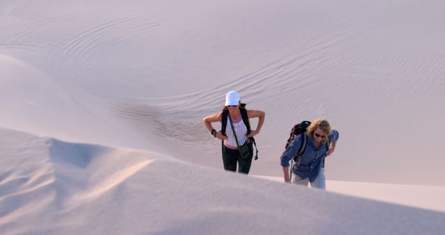 Two Women Hiking in Sand Dunes at Sunset - Download Free Stock Images Pikwizard.com