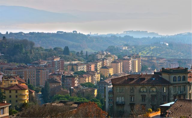Panoramic View of Italian City Amid Rolling Hills - Download Free Stock Photos Pikwizard.com