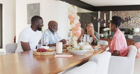Family Celebrating Graduation Party in Modern Home Atmosphere