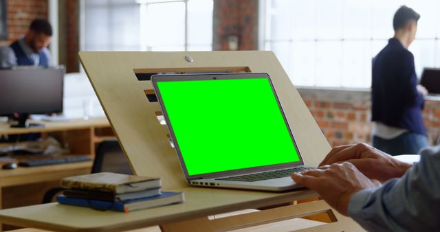 Modern Office Workspace with Green Screen Laptop - Download Free Stock Images Pikwizard.com