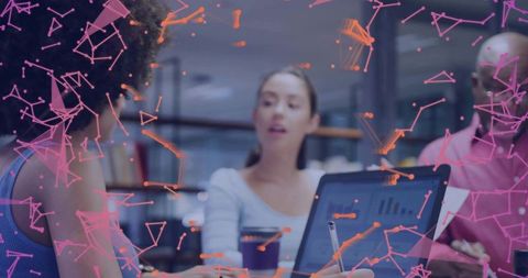 Creative Team Collaborating in Modern Office with Digital Network Overlay