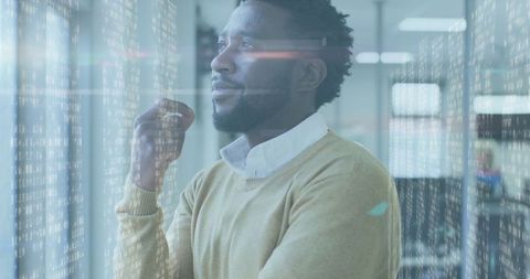 Contemplative Businessman Analyzing Digital Data in Office