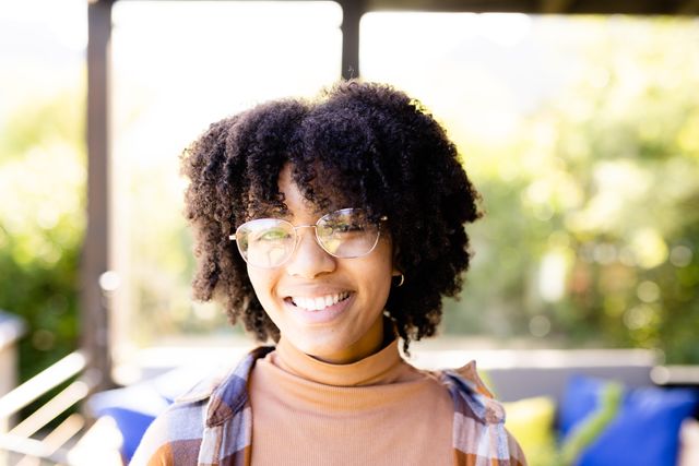 Smiling African American Teenage Girl on Balcony - Download Free Stock Images Pikwizard.com