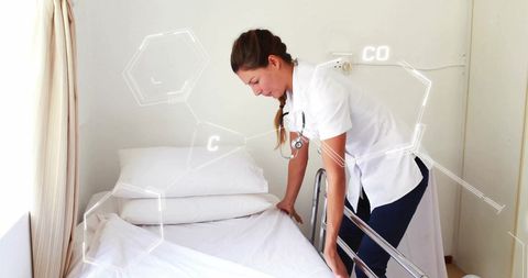 Nurse Adjusting Hospital Bed Connecting Healthcare and Technology