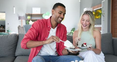 Couple Celebrating Birthday at Home With Dessert
