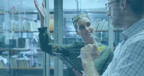 Collaborative Innovation Over Glass Board in Office Setting