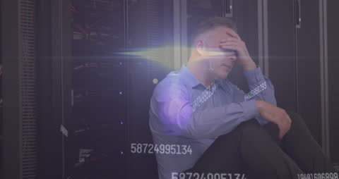 Stressed Businessman Experiencing Data Overload in Server Room