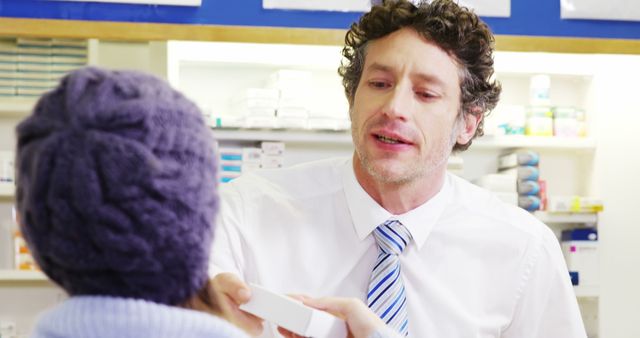 Pharmacist Assisting Customer with Prescription Medication - Download Free Stock Photos Pikwizard.com