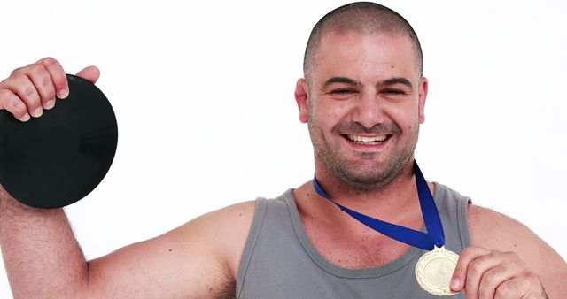 Athletic Man Celebrating with Gold Medal and Disc - Download Free Stock Images Pikwizard.com