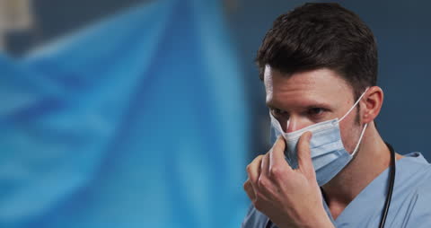 Focused Surgeon Wearing Mask in Medical Setting