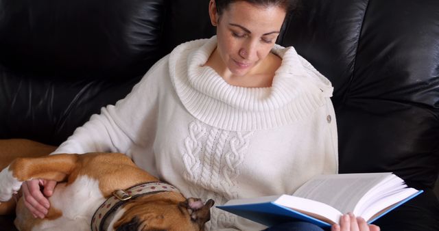 Woman Relaxing and Reading Book with Dog on Couch - Download Free Stock Images Pikwizard.com