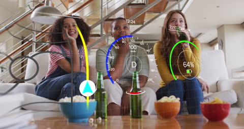 Diverse Friends Engaging with Futuristic Digital Interface at Home