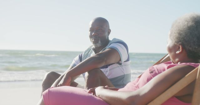 Senior Couple Relaxing at Beach Enjoying Sunny Day - Download Free Stock Images Pikwizard.com