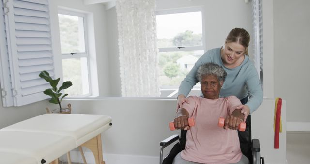 Physical Therapist Assisting Senior Woman with Exercise in Wheelchair - Download Free Stock Images Pikwizard.com