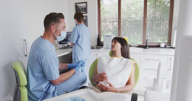 Dentist and Patient Discussing Treatment in Dental Office - Download Free Stock Images Pikwizard.com