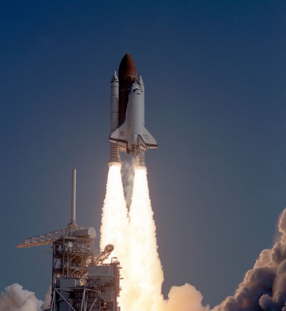 Space Shuttle Discovery captures dramatic moment of liftoff for STS-29 mission from Kennedy Space Center on March 13, 1989. Ideal for use in educational materials about space exploration, NASA's history, and rocket engineering. Also suitable for articles discussing the Tracking and Data Relay Satellite system and advancements in space travel technology.