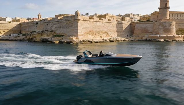 Luxury speedboat cruising past historic coastal fortress leaving wake in sunlit harbor