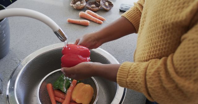 Person Washing Bell Peppers and Carrots in Kitchen Sink - Download Free Stock Images Pikwizard.com