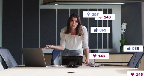 Businesswoman discussing social media engagement in conference room