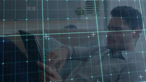 Man Engaging with Augmented Reality Interface on Tablet at Home