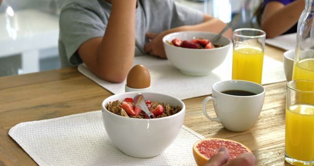 Family Breakfast Table with Cereal, Juice, and Coffee - Download Free Stock Images Pikwizard.com