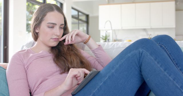 Young Woman Relaxing on Couch Using Tablet - Download Free Stock Images Pikwizard.com