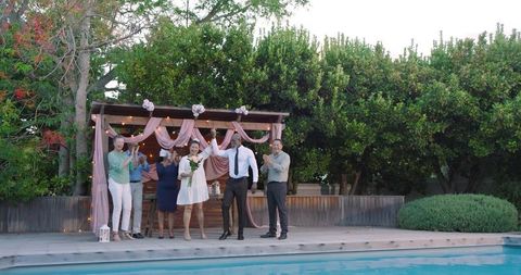 Diverse Wedding Celebration Joyfully By Sunny Poolside
