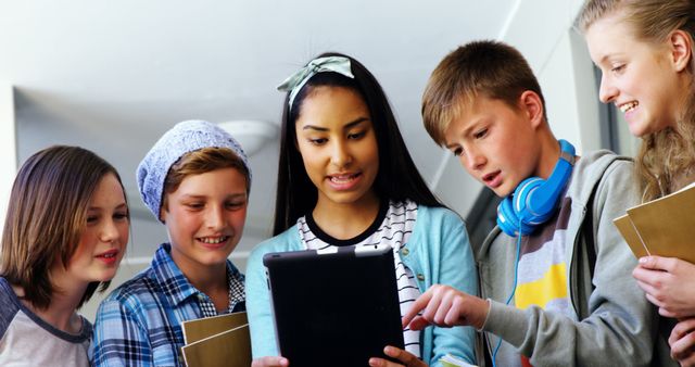 Diverse Group of Teenagers Using Tablet for Study - Download Free Stock Images Pikwizard.com