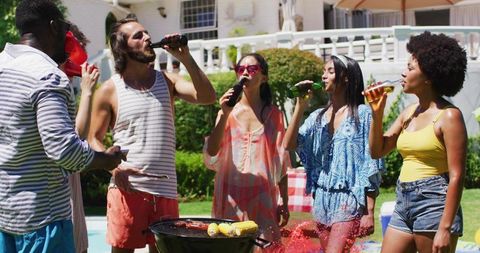 Diverse Group Enjoying Barbecue by Poolside in Summer