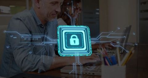 Coworking Team Securing Digital Data with Holographic Padlock Over Laptops in Modern Office