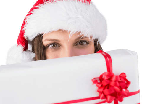 Festive woman hiding behind christmas gift with transparent background
