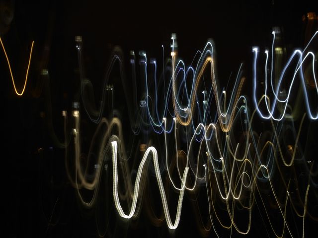 Abstract light trails create dynamic and energetic visual patterns on a dark background. Well-suited for creative projects, background images, album covers, digital art, and modern web design themes. Can be used to convey themes of movement, energy, and nightlife.
