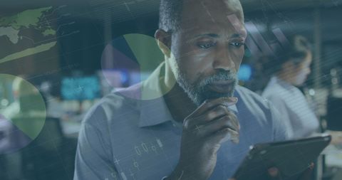 African American Businessman Analyzing Data in Modern Office