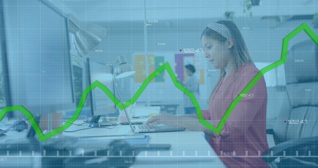 Businesswoman Analyzing Financial Data at Office Workstation - Download Free Stock Images Pikwizard.com