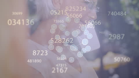 Senior Woman Using Laptop with Technology Overlay