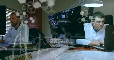 Scientists analyzing data in technology research laboratory