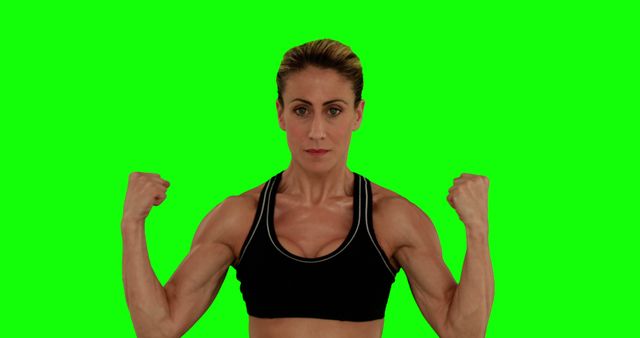 Strong Woman Flexing Biceps on Green Screen Background - Download Free Stock Images Pikwizard.com