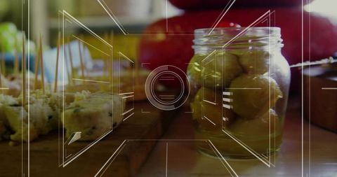 Gourmet Olives in Jar with Holographic Display in Modern Kitchen