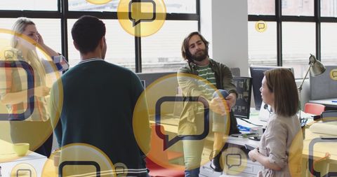 Diverse Team Networking in Modern Office with Media Icons