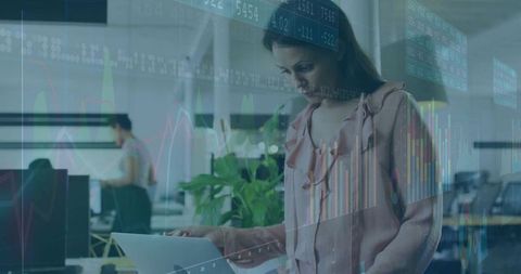 Woman Analyzing Market Data in Modern Office Environment